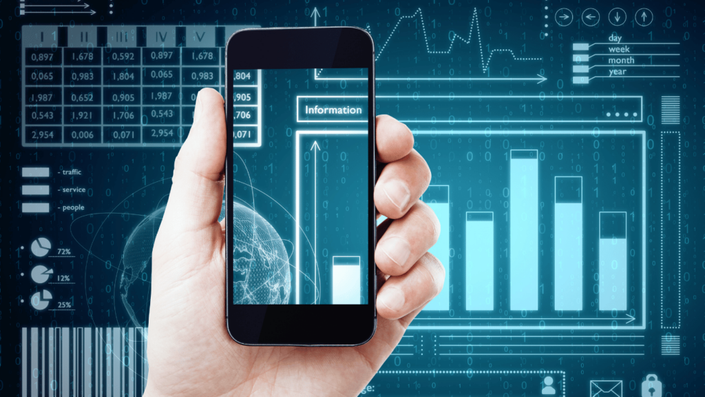 Hand holding a smartphone displaying data and AI-powered graphs, with a futuristic data-driven background.