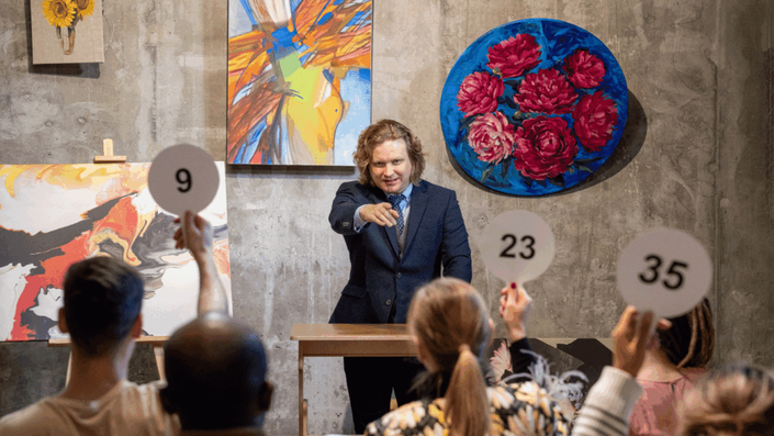 A bustling French art auction in Paris, with bidders and colorful paintings, illustrating a shift from CAC 40 investments to cultural assets.
