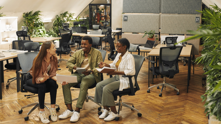Eco-friendly coworking space designed for flexible Hybrid Work setups promoting sustainability and collaboration.