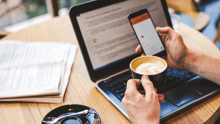Young adult in France reviewing their monthly budget at a café while considering Buy Now Pay Later options.